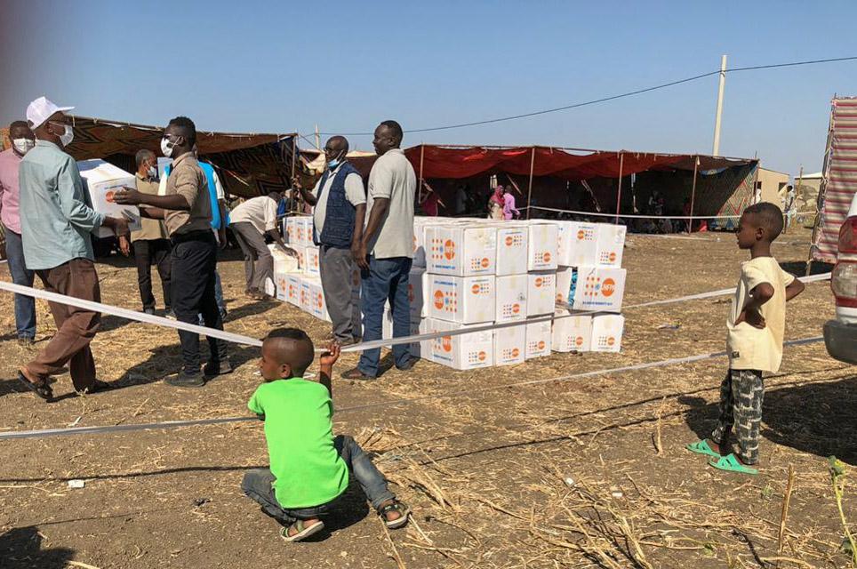 A picture of refugees standing outside Um Rakuba camp in Sudan, 19 November 2020