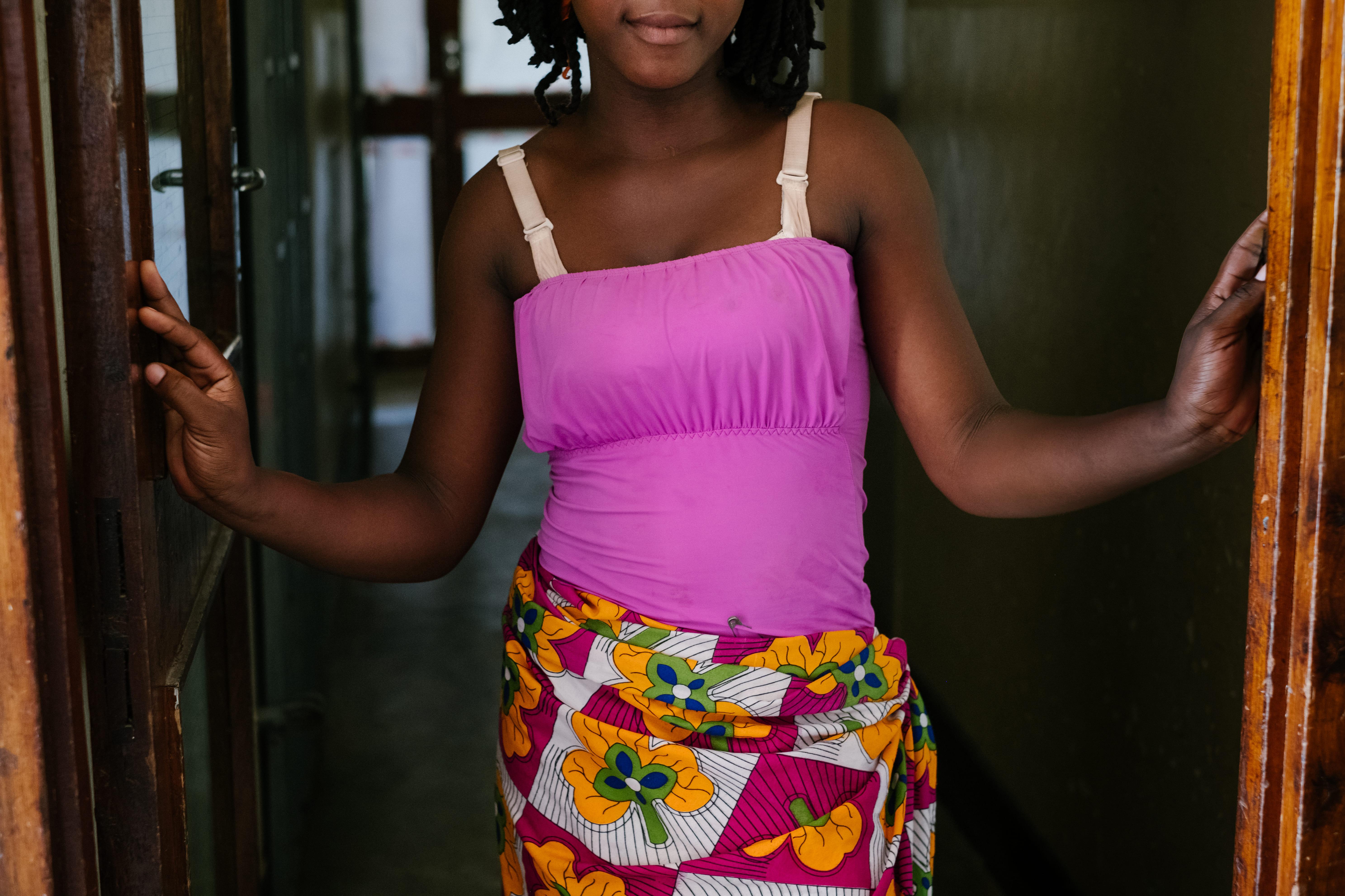 Ketisha standing in the door way of a bar hotspot in the centre of Mwanza town