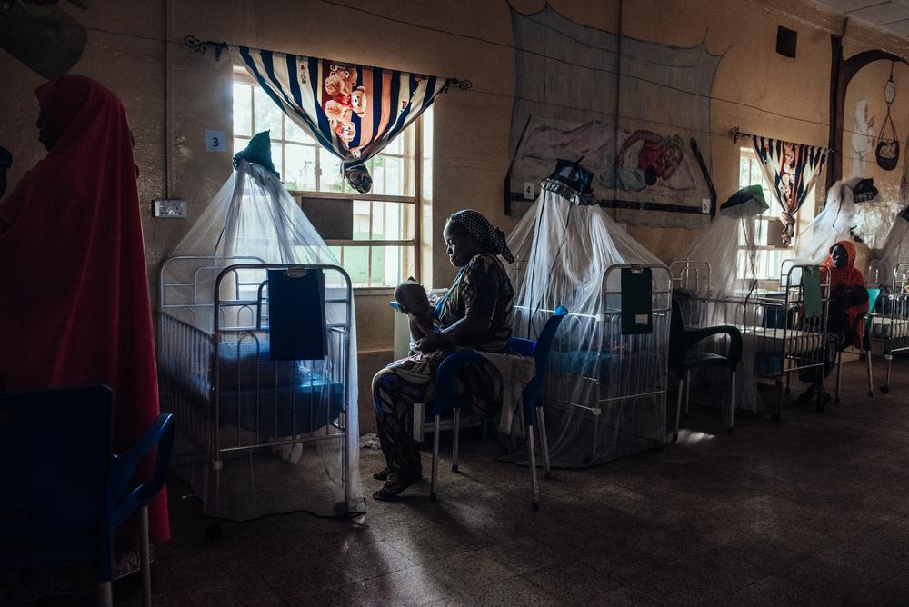 Amaka Joseph, 35, tends to her recovering child