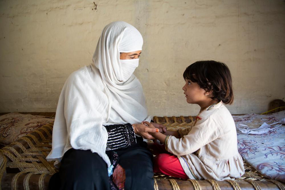 Gulnaz plays with her daughter