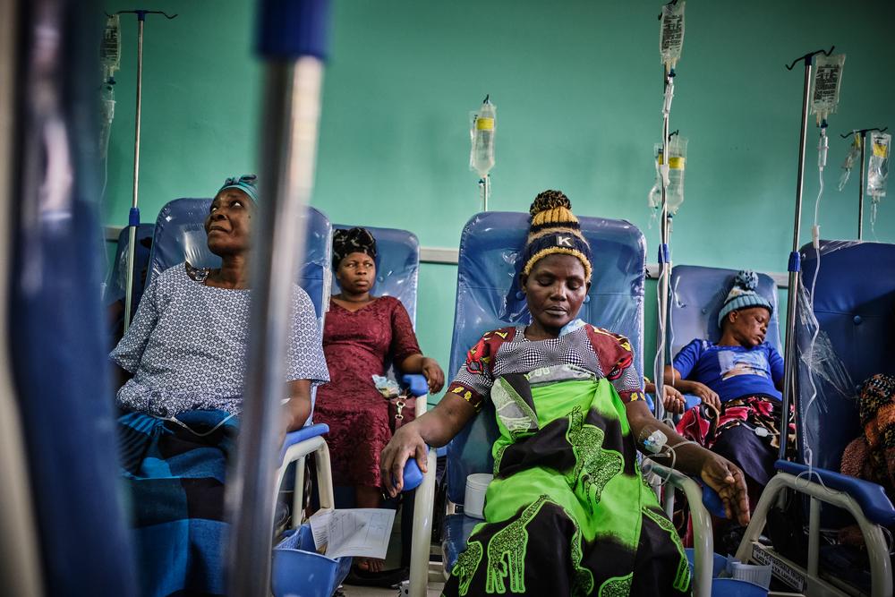 Patients sitting in medical facility receiving treatment, palliative care