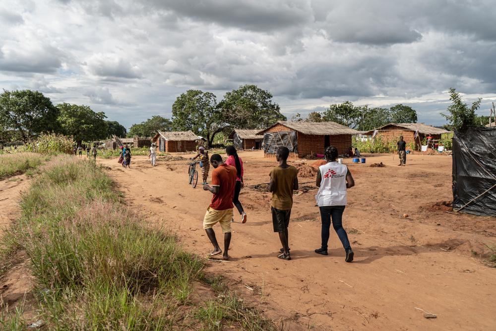 MSF staff walk through Nicuapa, a camp for people displaced by the armed conflict in Cabo Delgado in northern Mozambique. The camp has seen an influx of people fleeing their homes and needing medical care as a result the of the armed conflict in the area.