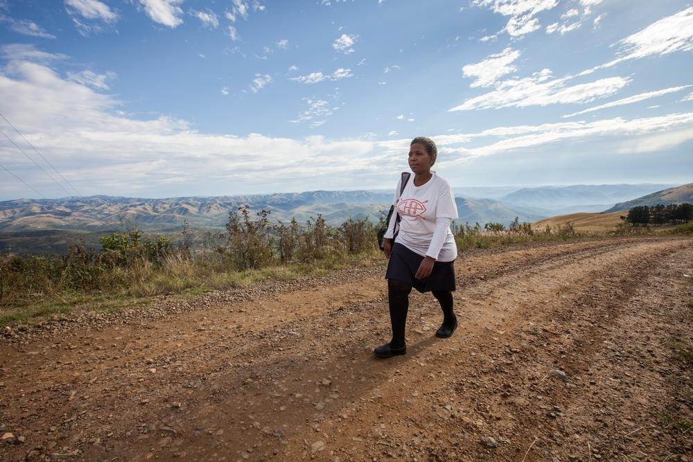 A community health agent on her way to deliver HIV counseling and testing services
