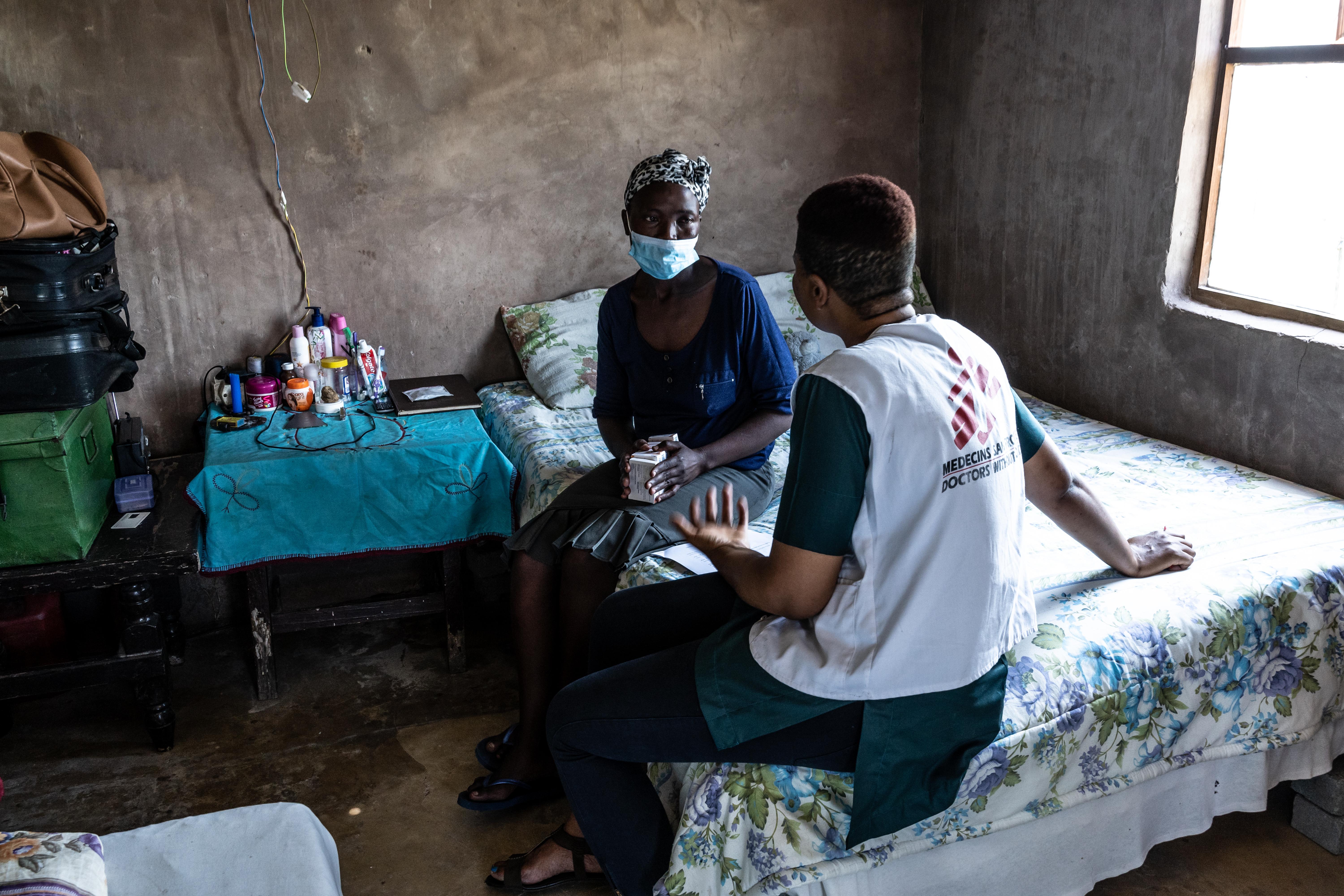 Phenduka Mtshali, a patient with Drug Resistant Tuberculosis (DR-TB), is seen in her home in Mbongolwane, South Africa speaking with MSF fieldworker, Celiwe Dlamini. 