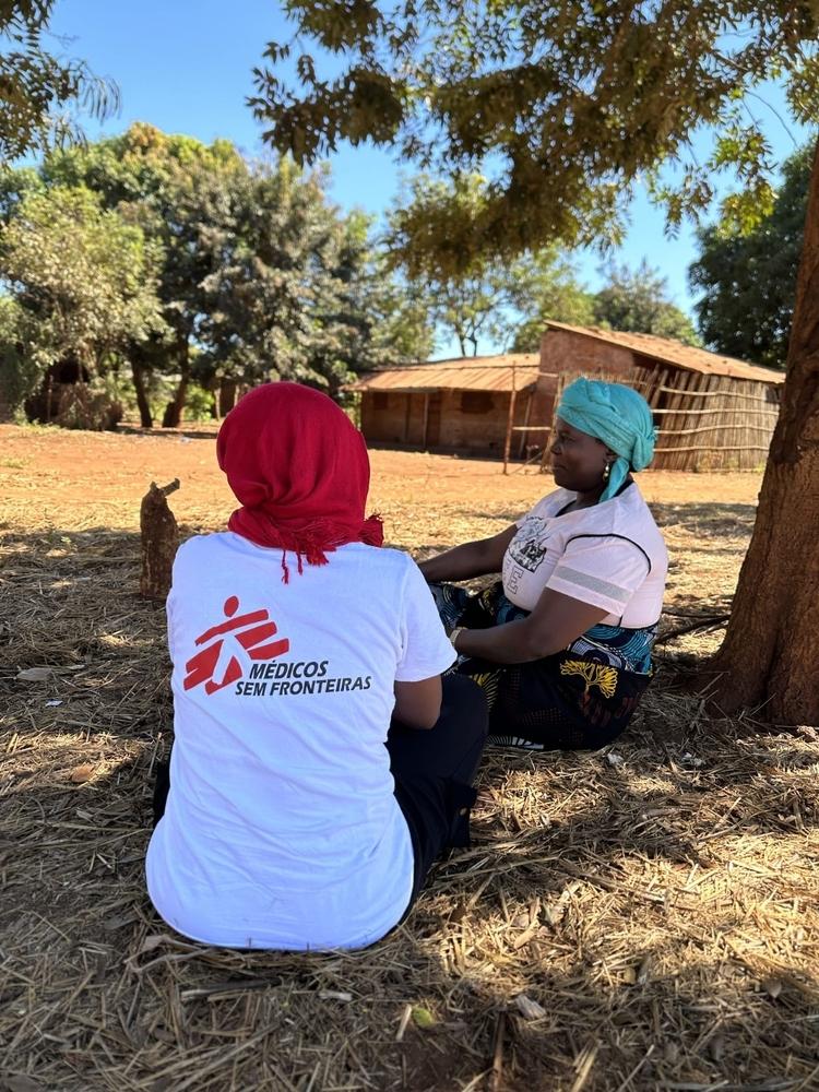 Jacinta Francisco, Emergency Team Lead, talks to a woman who recently arrived in Nanjua,