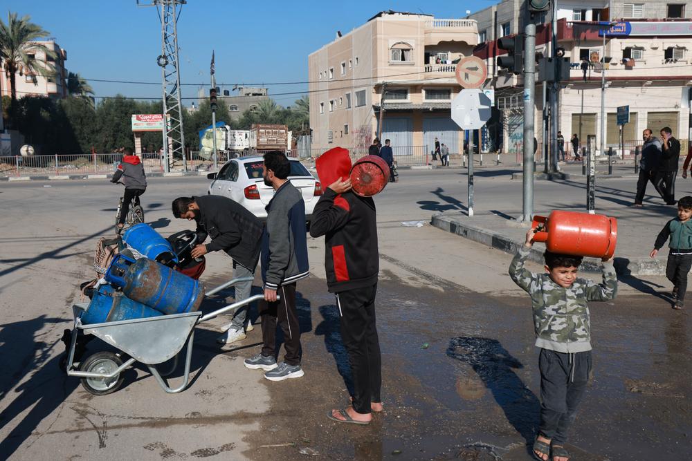 Image of People looking for fuel, food and gas, queuing for hours sometimes. Near Al Aqsa hospital. 29 November 2023, Middle Area, Gaza.