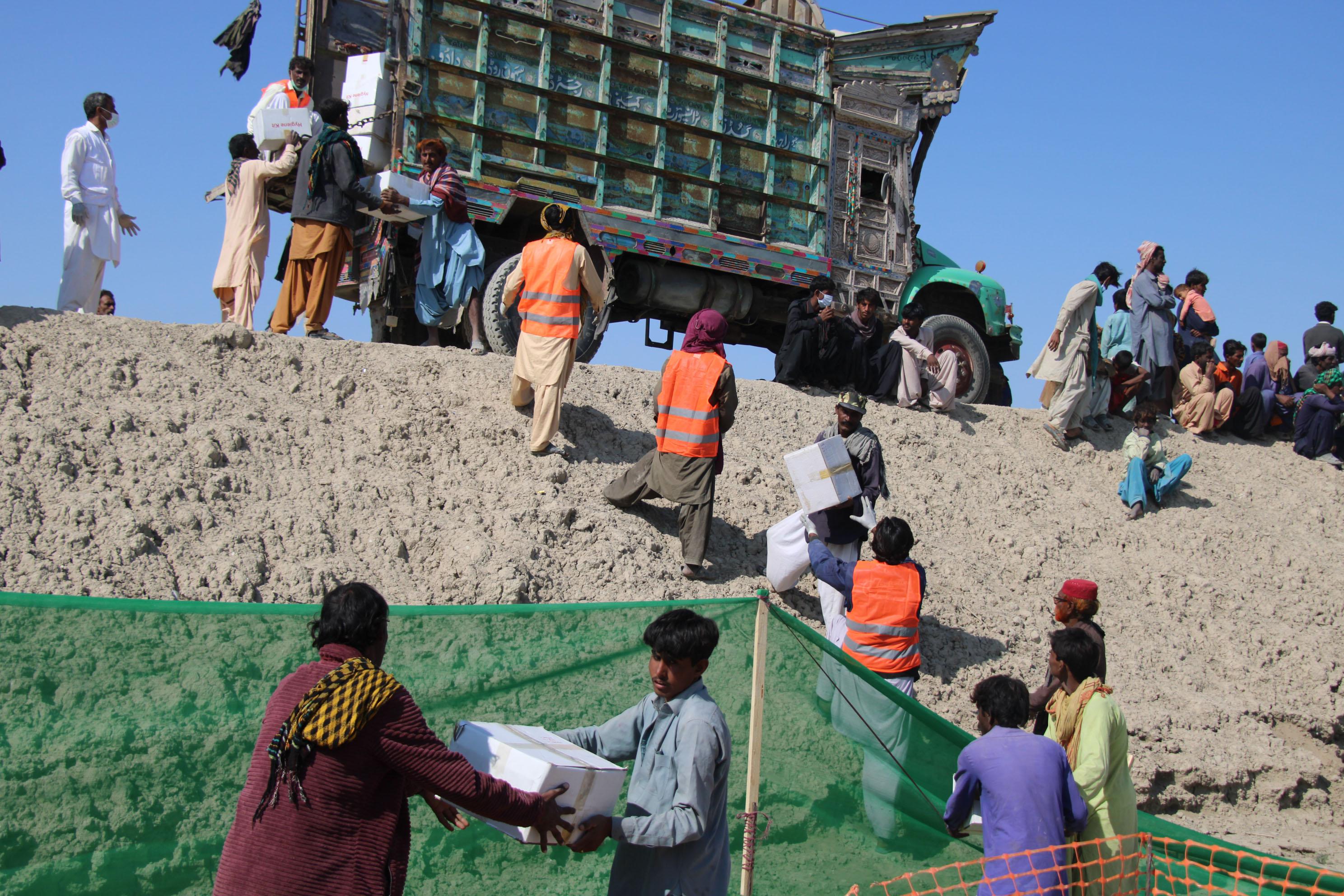 MSF staff distributing relief packages in the Dadu district, Pakistan