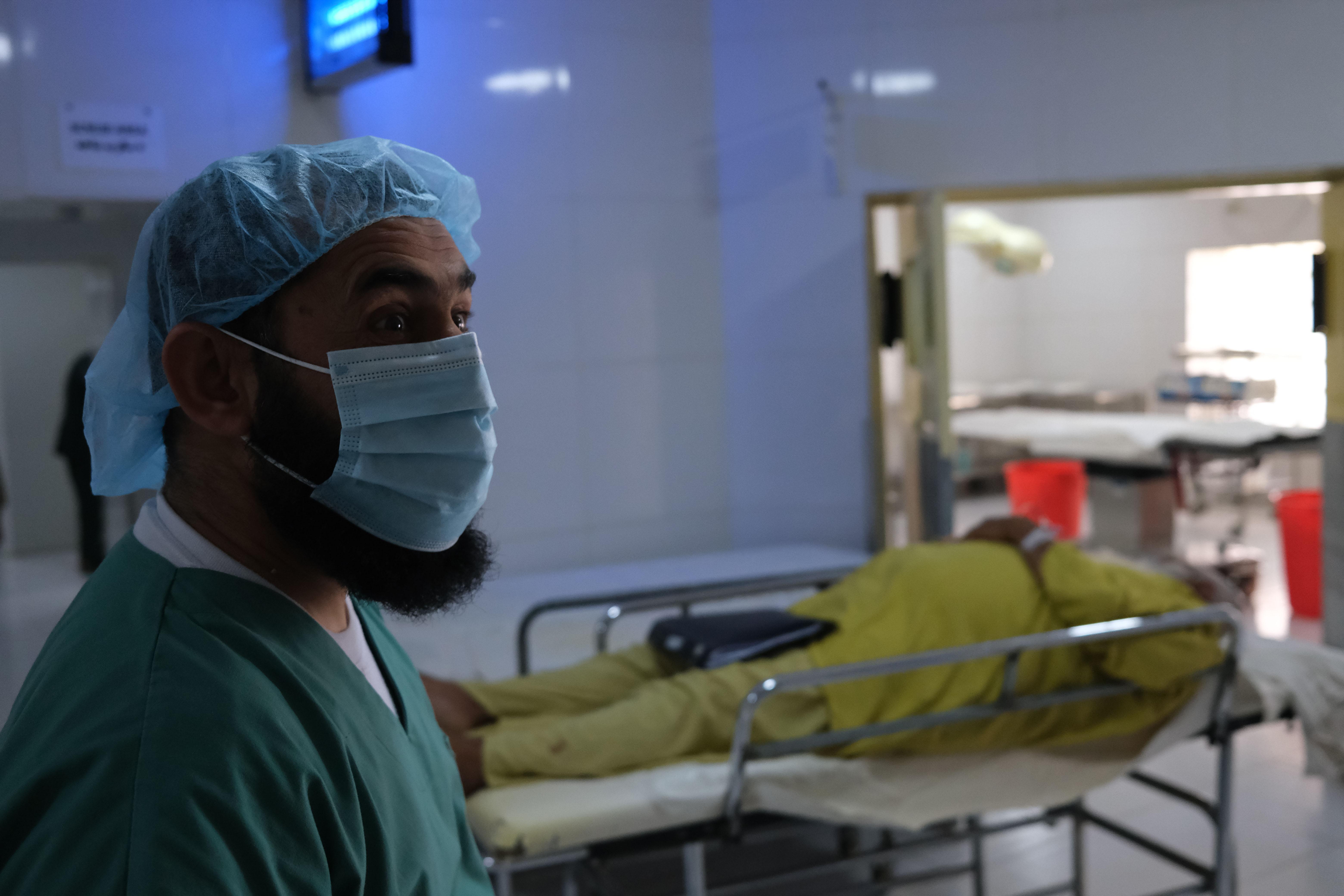 MSF surgeon performing surgery to remove a kidney stone from a patient in Boost Hospital, Afghanistan.