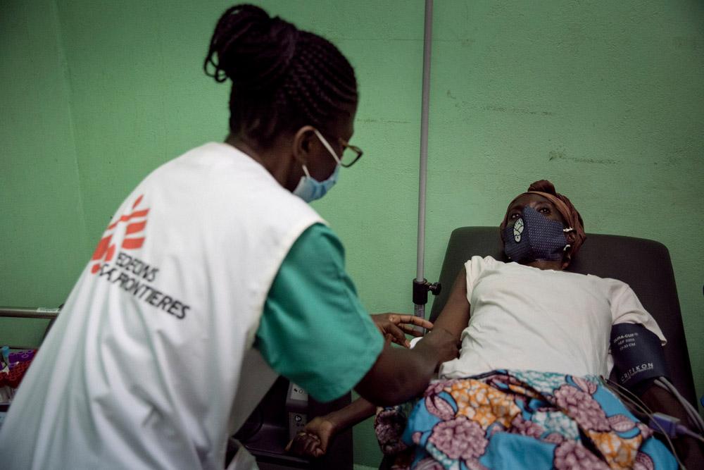MSF nurse treating a patient with HIV