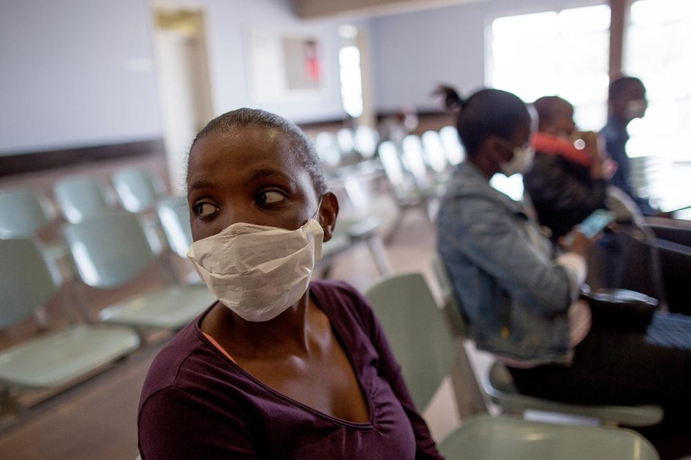 A patient, Sibongile waits for her appointment at the Town 2 Clinic, Kuyasa, Khayelitsha, Western Cape, South Africa.