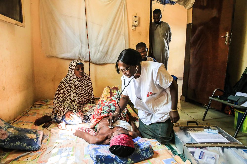 MSF doctor Djenabou Diallo examines her 77yo patient Bambi Gandega in Bamako, Mali