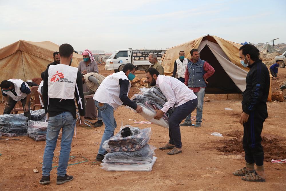 MSF staff distributing winter kits for displaced people