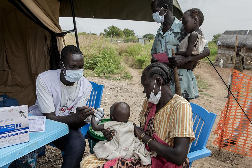 A member of MSF staff does a rapid malaria test before children receive the SMC medication in a seasonal malaria chemoprevention distribution site in the village of Kuom, South Sudan, October 27th, 2021. 