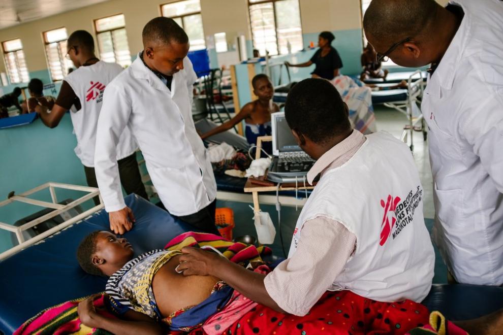 MSF healthworkers examining patients with advanced HIV in Nsanje , Malawi.