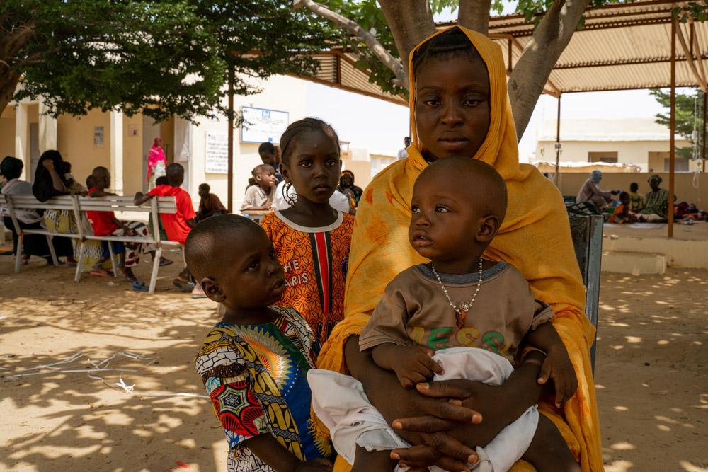 Parent waiting with her child to get vaccinated against measles