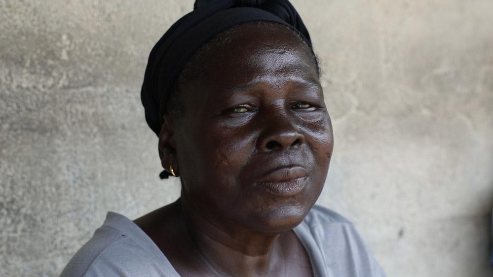 Almar, a patient treated for epilepsy in the West Point township of Monrovia, Liberia, during a home visit by a team of MSF staff and local health workers.