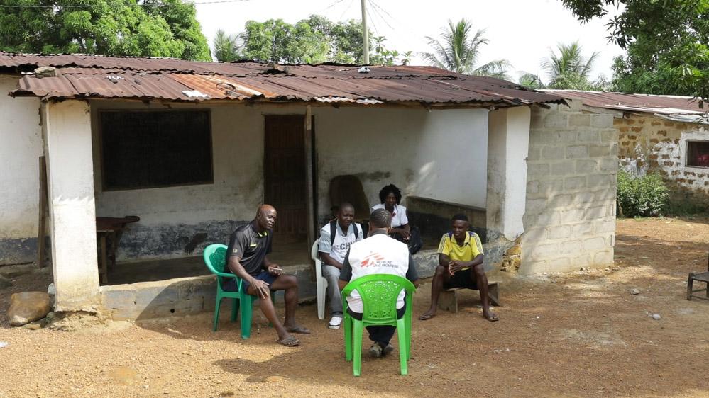 Health worker with epilepsy patient Amuchin in Liberia