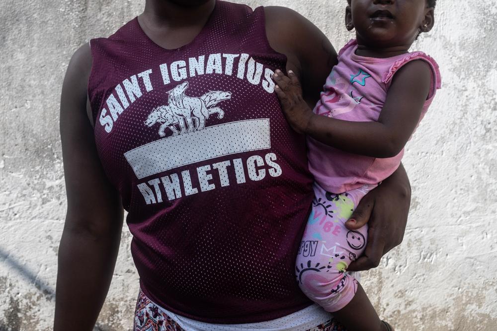 Image of Michelle holding her baby, safe abortion care in Mozambique. 