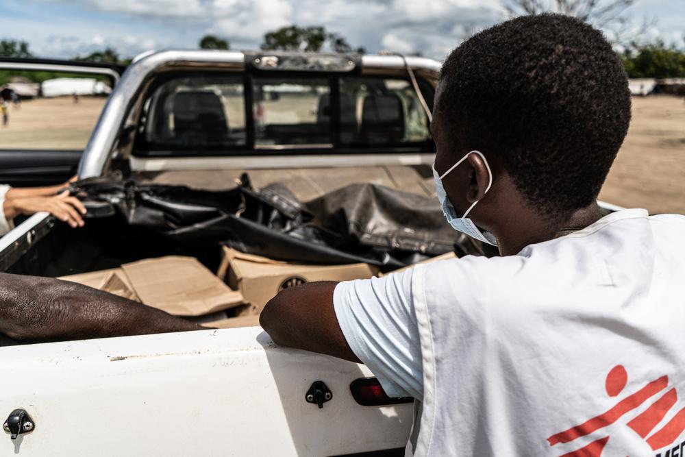 MSF logistical team unload supplies at the Nangua camp for internally displaced people