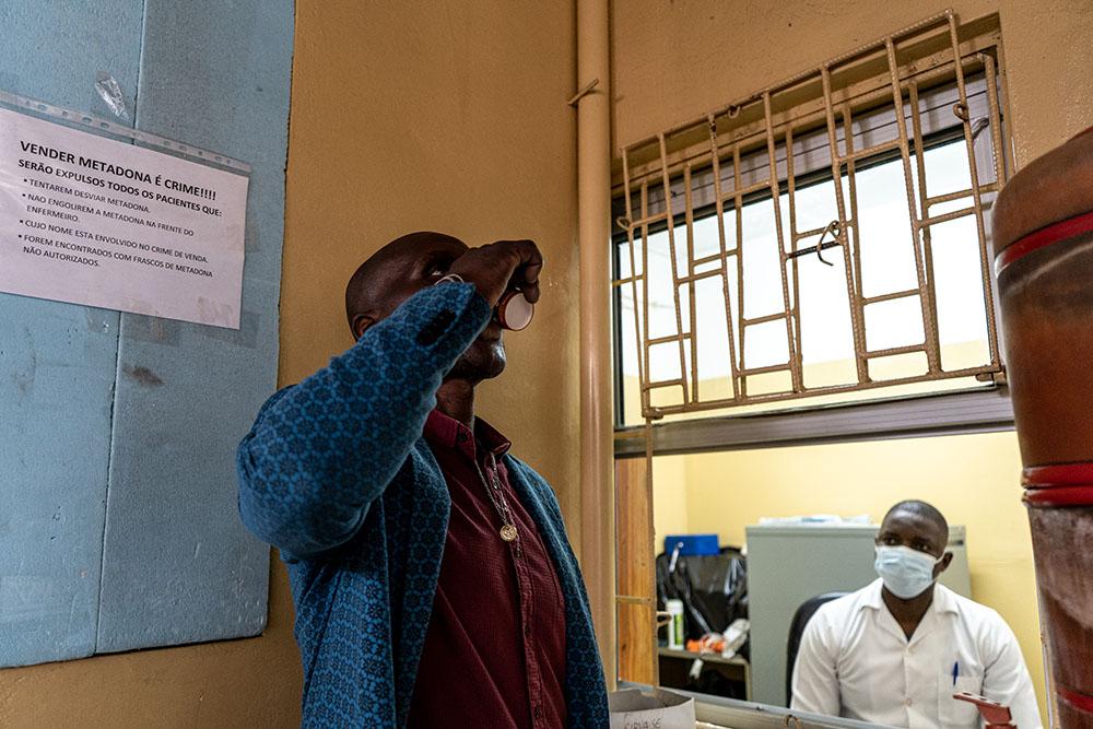 Yochanna, a recovering drug user who is enrolled in MSF’s treatment programme for people who use drugs in Maputo, is seen at the window of MSF’s methadone programme in Maputo. He and other recovering drug users collect methadone, a medication which suppresses the withdrawal symptoms which recovering users feel after stopping using opiates. 