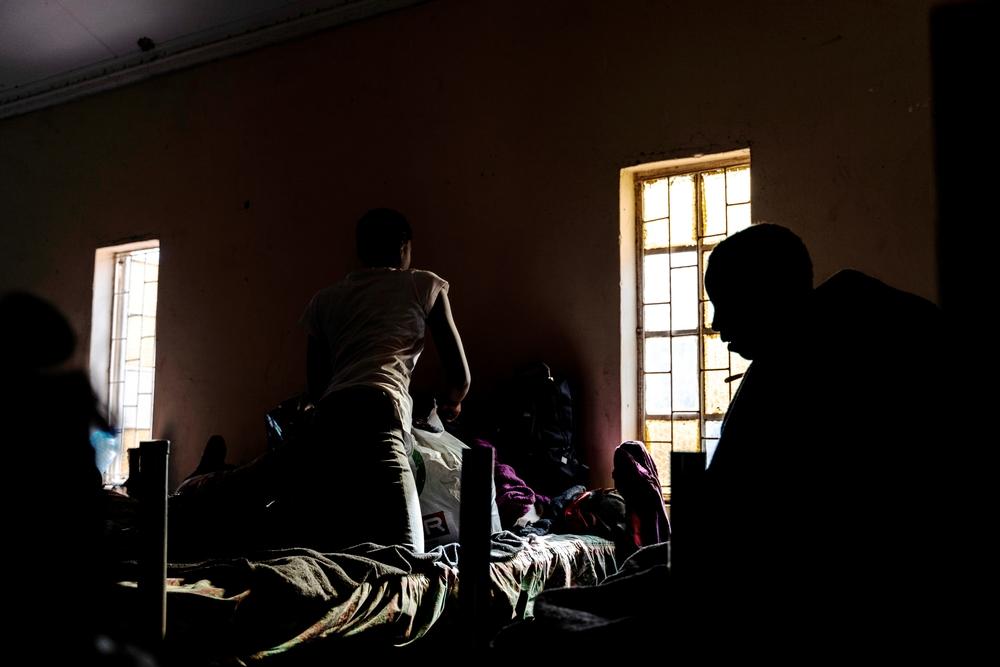 Women sitting on their beds at a centre for female refugees located in Musina, South Africa. 