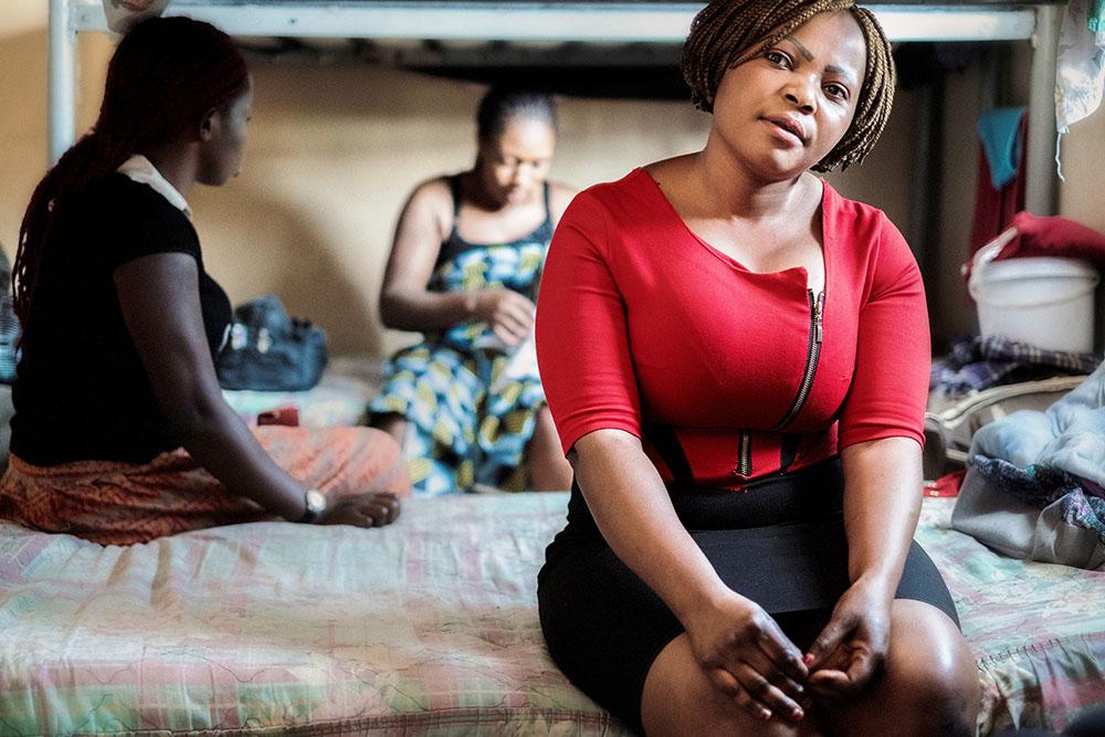 A woman sitting in the temporary shelter for migrants in Musina.