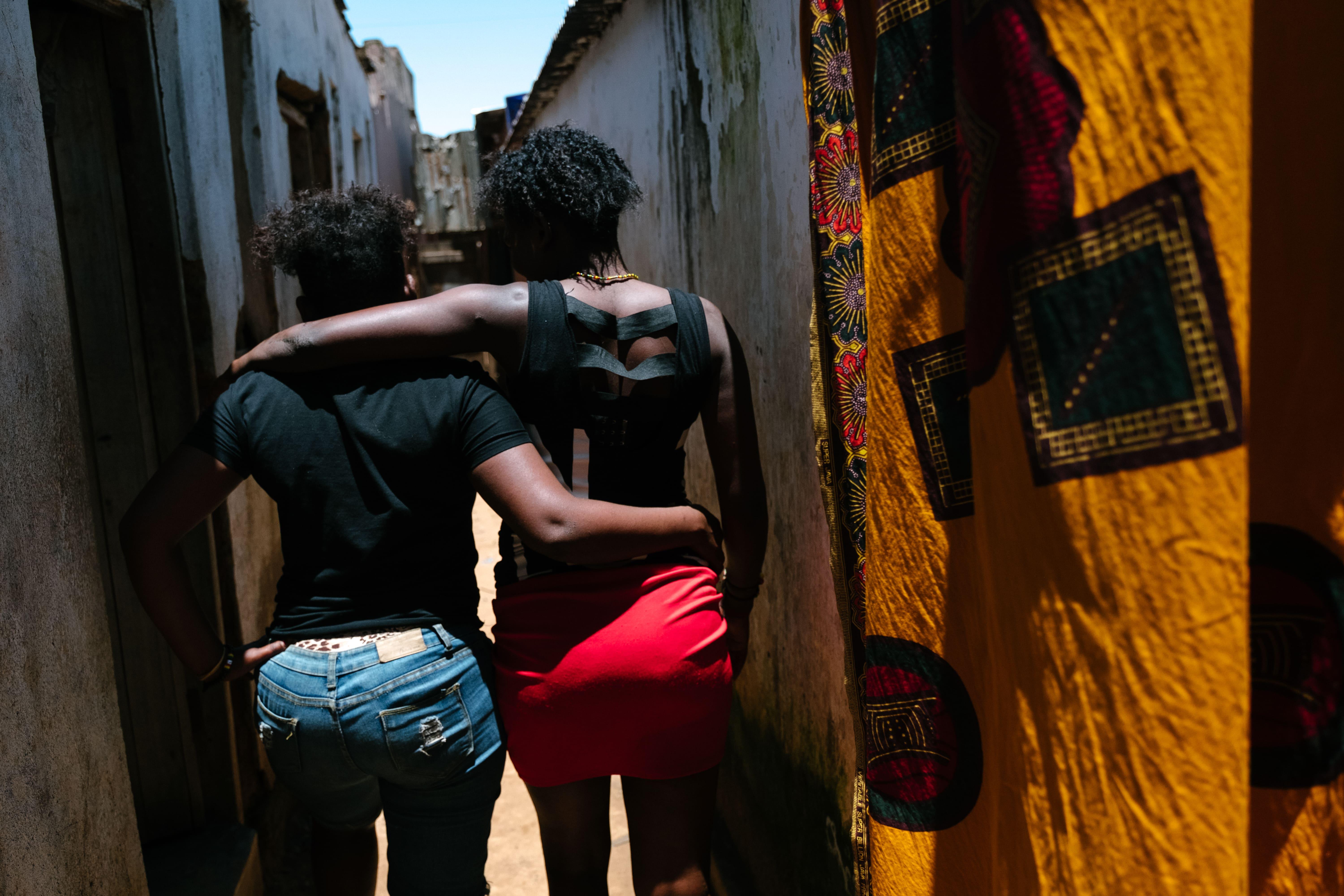 A picture of two sex workers heading to the bar section in Malawi, Mwanza