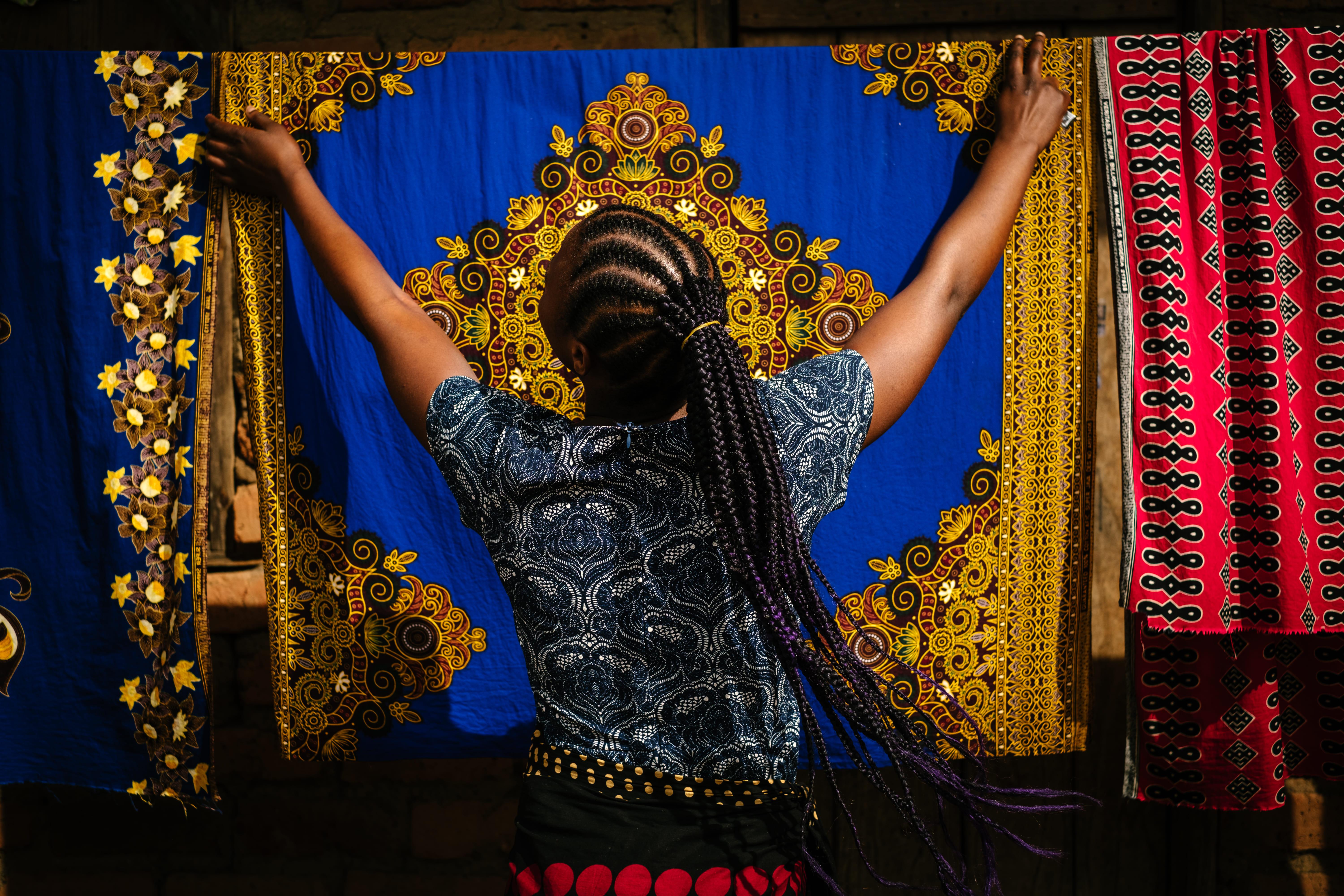 A picture of Maria* a sex worker hanging up her washing in Dedza town, Malawi