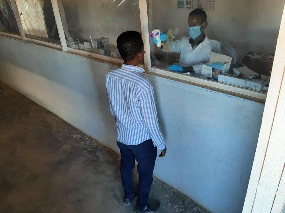 A picture of a man getting screened for COVID-19 in  Galkayo South Hospital, Somalia