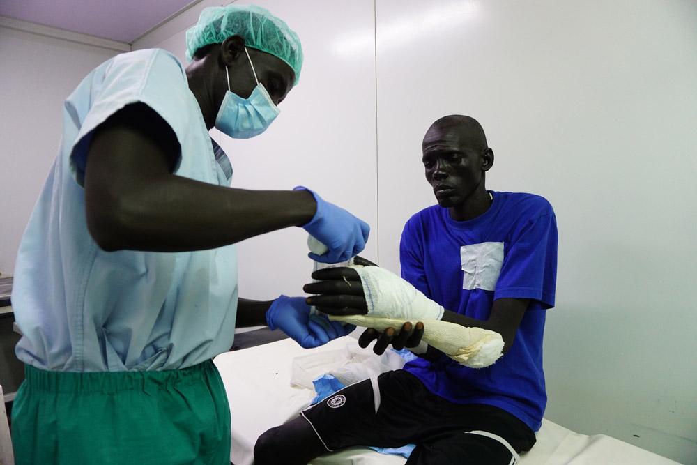 Patient getting medical care for broken arm at Pieri Clinic