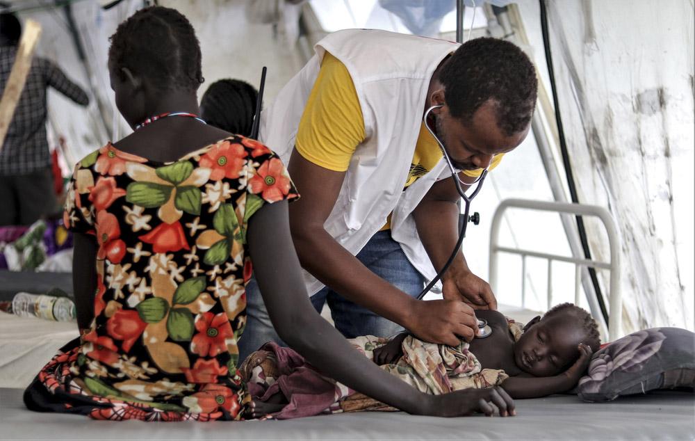 Patient being checked by MSF staff
