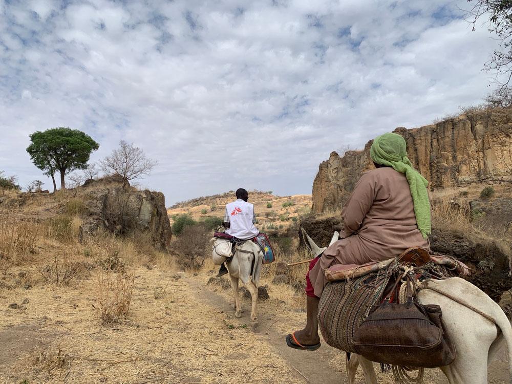 MSF team on their way to Dilli village to deliver healthcare supplies. Jebel Marra Mountains, Darfur Region. Sudan