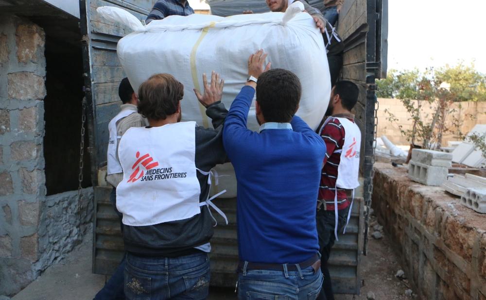 Tents and supplies are loaded into the back of a truck bound for an area his by epidemics and pandemics