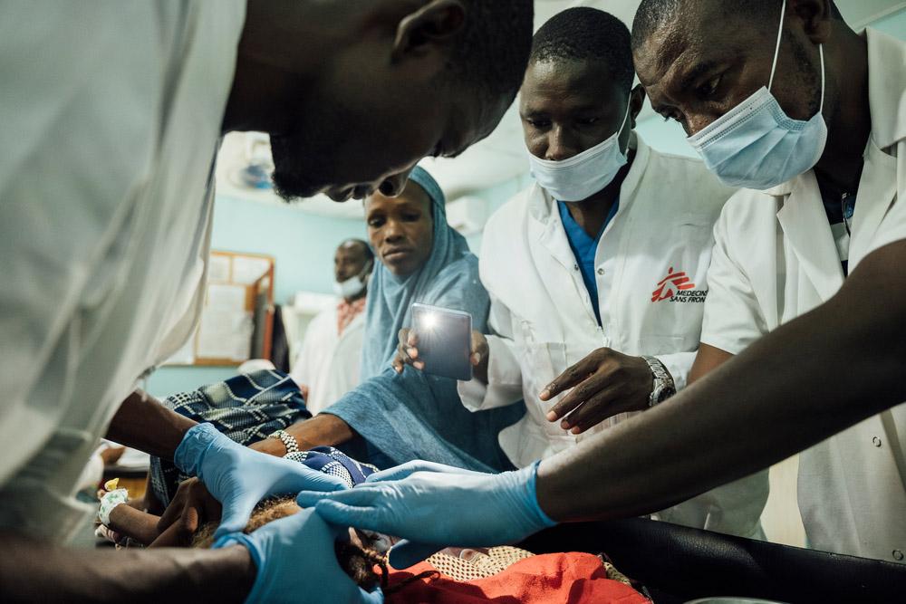 Halima is being treated for head wound by MSF staff