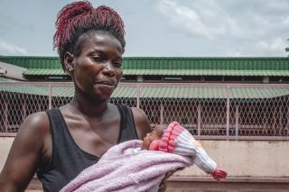 Carine Dembali, holds her son born at the MSF-supported maternity of the Community Hospital Centre (CHUC), Bangui, Central African Republic