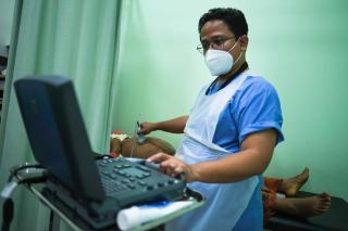 Doctors Without Borders (MSF) Dr Muhammad Afiq Adnar performing an ultrasound scan
