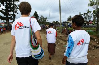 Doctors Without Borders (MSF) Family Support Center counsellors walk
