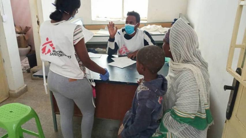 An MSF nurse and a translator prepare a donation of medical materials in Megab,