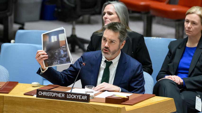 MSF’s Christopher Lockyear holds up an image of the destroyed MSF shelter in Al-Mawasi in Khan Younis, Gaza. Attacks on medical care are devastating