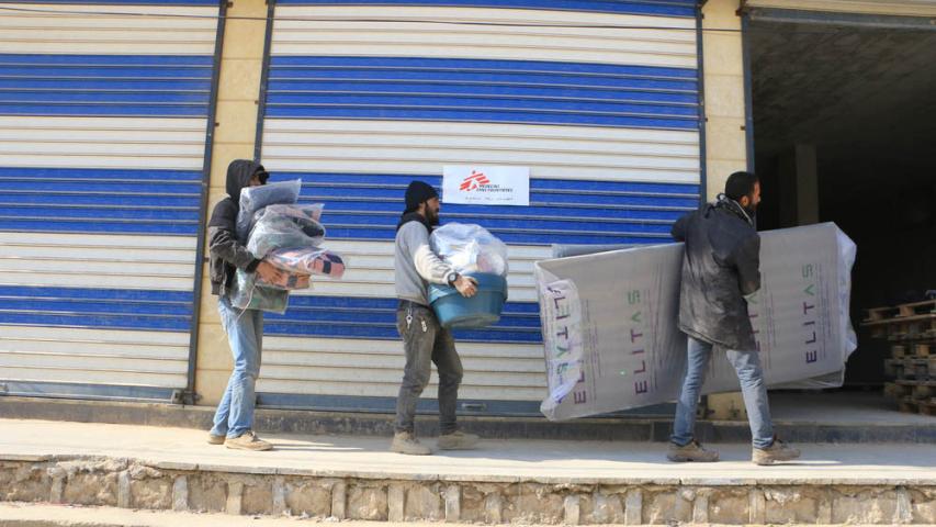 MSF team members loading trucks with necessities