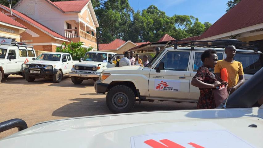 MSF health promoters discussing Ebola infection prevention and control measures with villagers in Kansambya