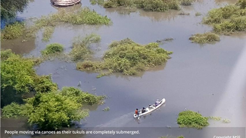 Submerged-tukuls-using-canoe