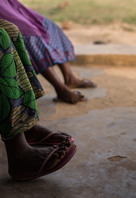 The feet of victims of sexual and gender-based violence are seen as they wait for their interviews.